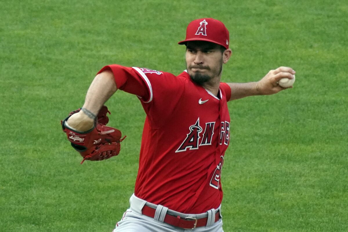 Los Angeles Angels pitcher Andrew Heaney throws to a Minnesota Twins.