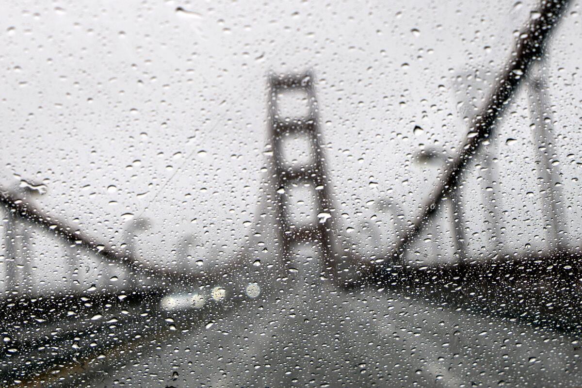The Golden Gate Bridge seen through a rainy windshield 