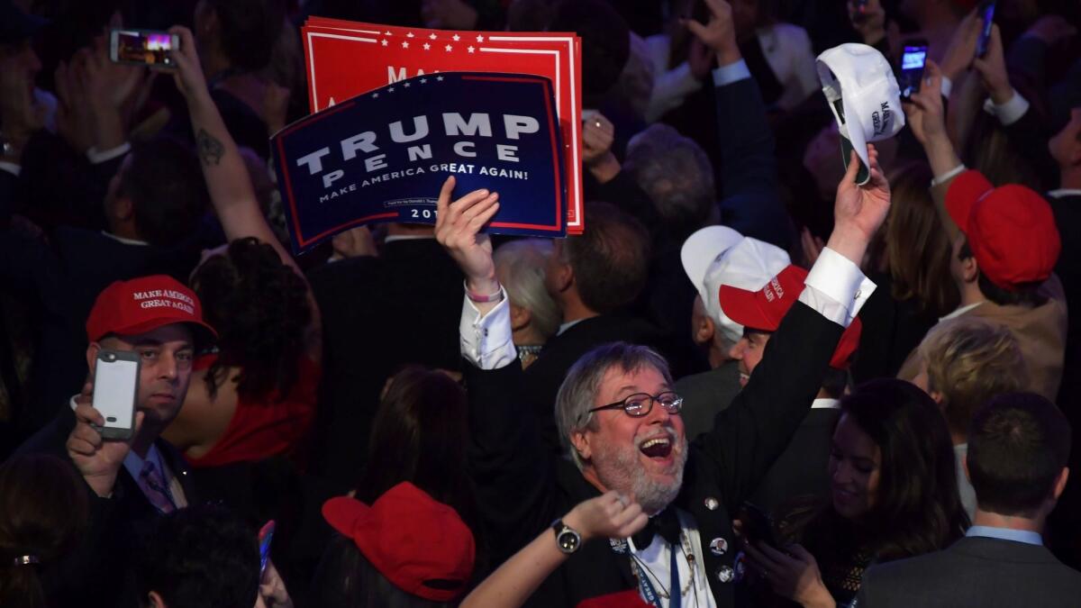 Supporters of Donald Trump cheer during his election night party in New York on Tuesday.