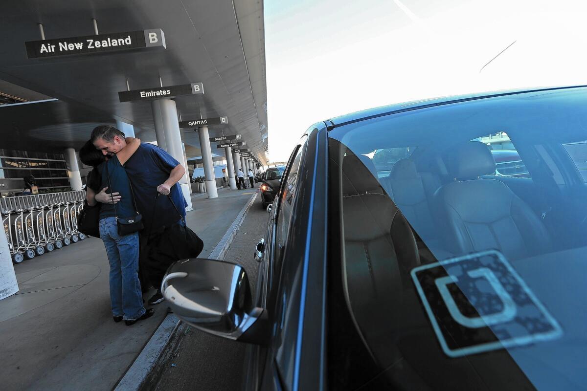 An Uber driver drops off a passenger as Los Angeles International Airport. At Bob Hope Airport in Burbank, officials are grappling with the impact ride-sharing services like Uber and Lyft have had on parking revenue.