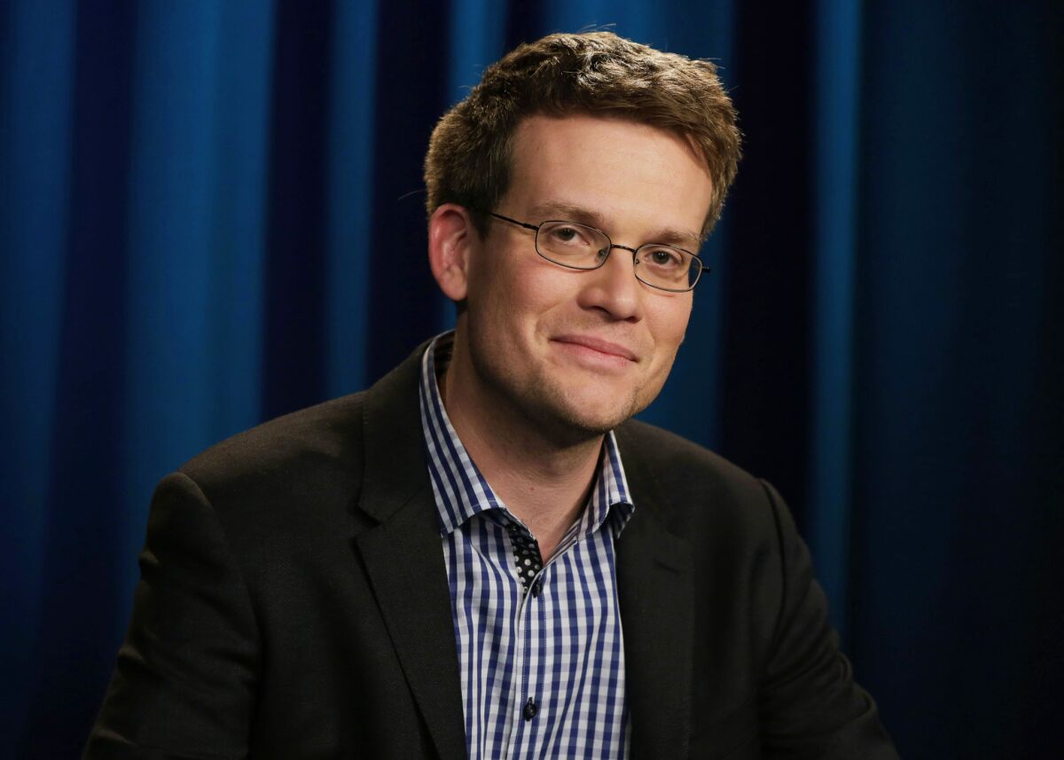 John Green's award-winning yoiung adult novel "Paper Towns" has been pulled from a middle-school summer reading list.