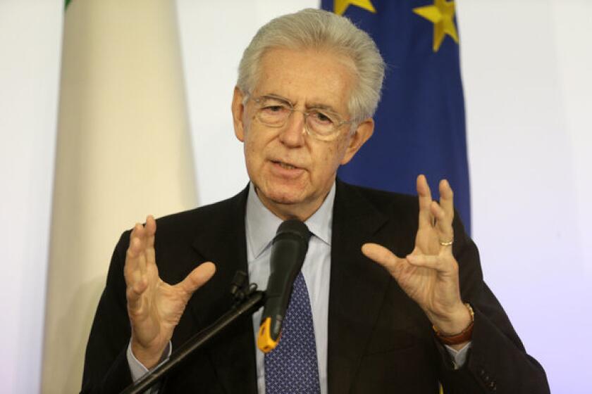 Italian Prime Minister Mario Monti speaks during a news conference in Rome.