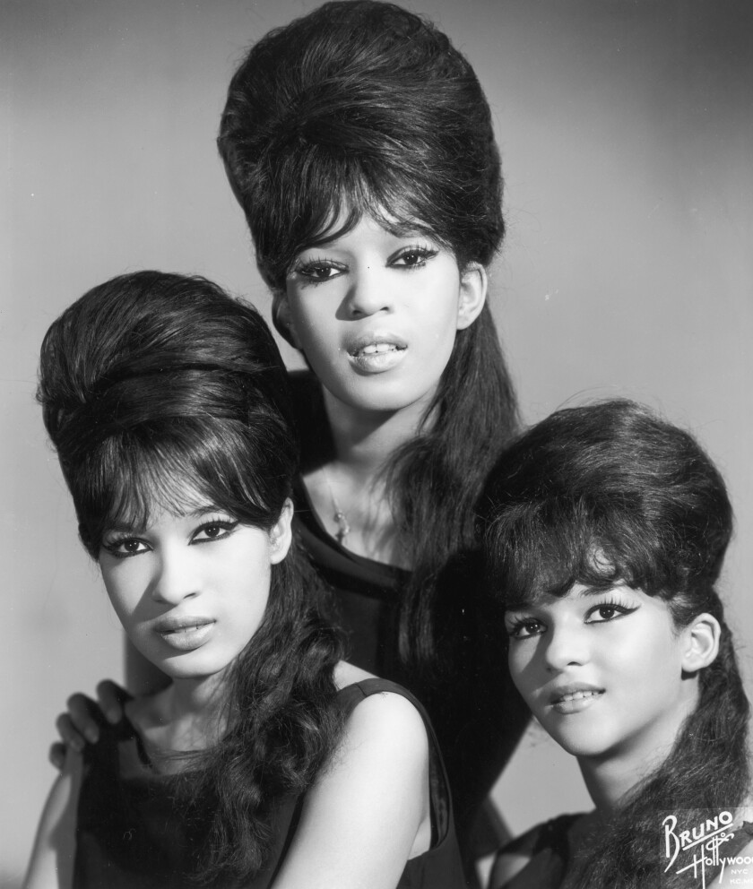 Three women with large, beehive hairdos