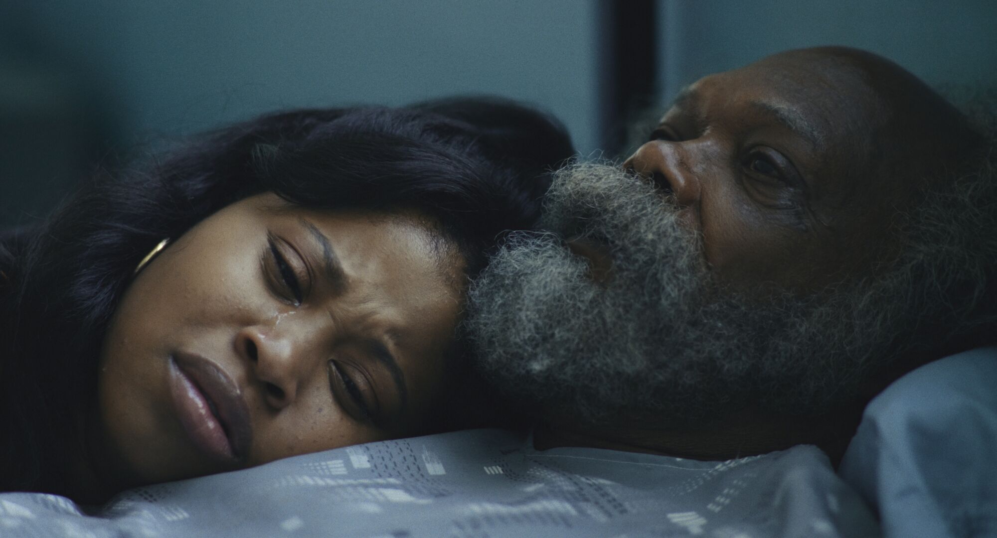 A man and woman hold each other in "The Last Days of Ptolemy Grey."