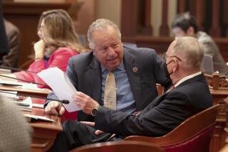 Democratic state Senators Bill Dodd, of Napa, left, and Richard Roth, of Riverside, talk at the Capitol in Sacramento, Calif., Tuesday, Sept. 12, 2023.(AP Photo/Rich Pedroncelli)