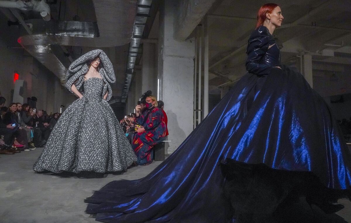 Fashion from Christian Siriano fall/winter 2022 collection is modeled during Fashion Week, Saturday Feb. 12, 2022, in New York. (AP Photo/Bebeto Matthews)