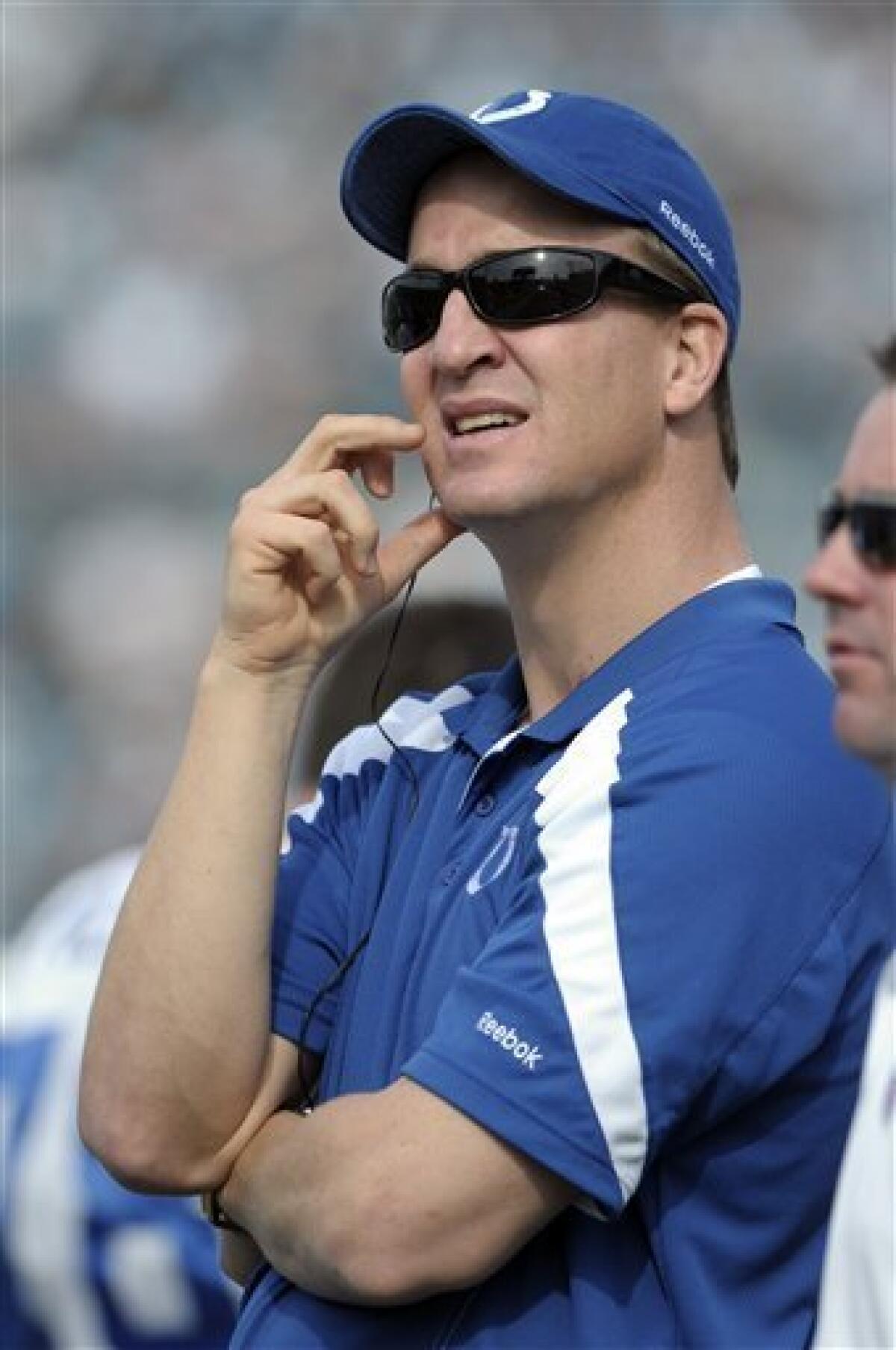 FILE - In this Jan. 1, 2012, file photo, Indianapolis Colts quarterback Peyton Manning watches from the sideline during the first half of an NFL football game against the Jacksonville Jaguars in Jacksonville, Fla. Shortly after introducing Chuck Pagano as Indianapolis' new coach, team owner Jim Irsay responded to the comments Manning made earlier this week about the Colts by referring to the only four-time league MVP as a "politician." (AP Photo/Phelan M. Ebenhack, File)