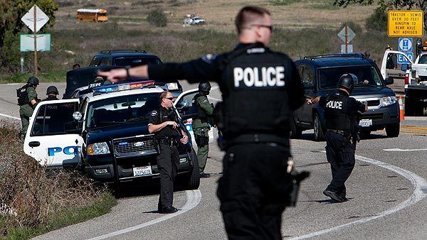 Officers from several law enforcement agencies man a roadblock on Highway 38 north of Redlands.