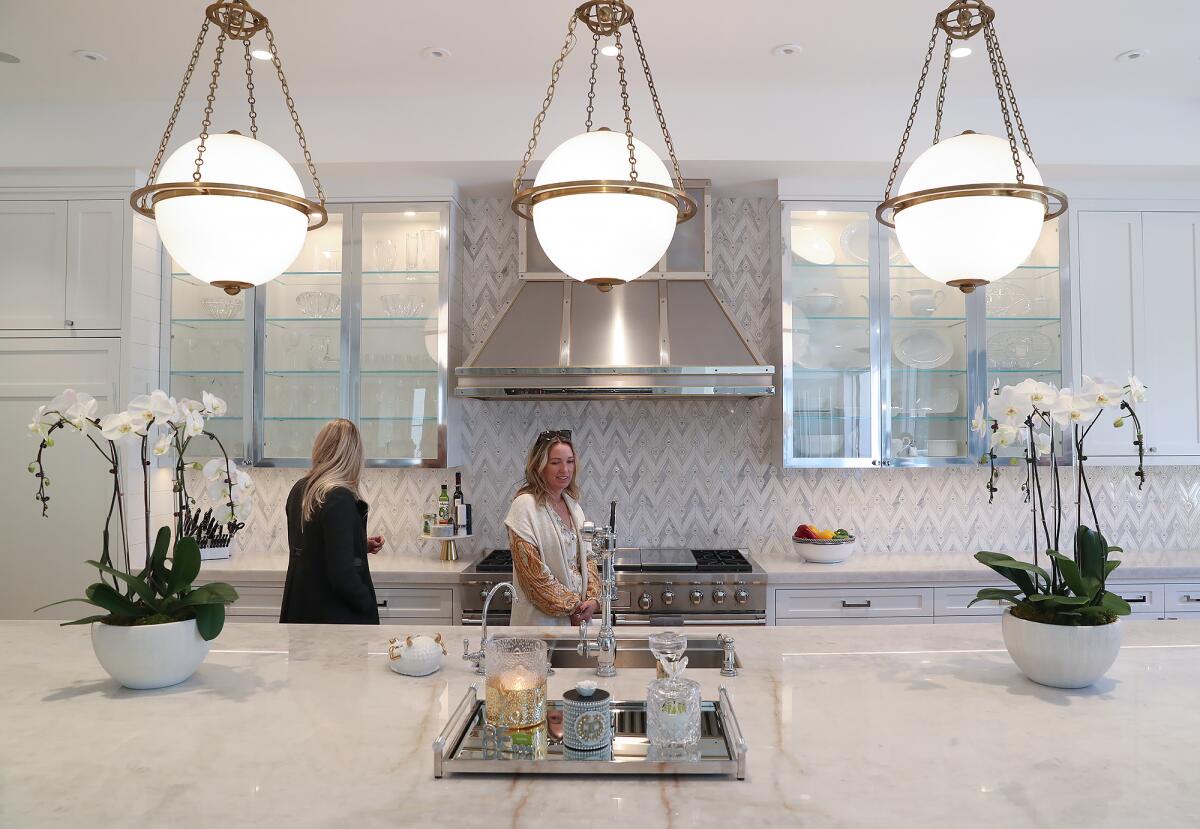 Guests tour the third stop, observing an open kitchen concept on the Corona del Mar Home Tour.