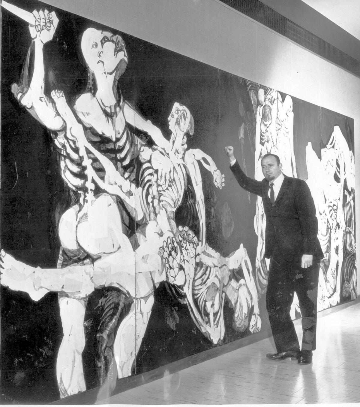 Connor Everts in 1962 with his mural "Thirst For Extinction," at Valley State College, now Cal State Northridge.