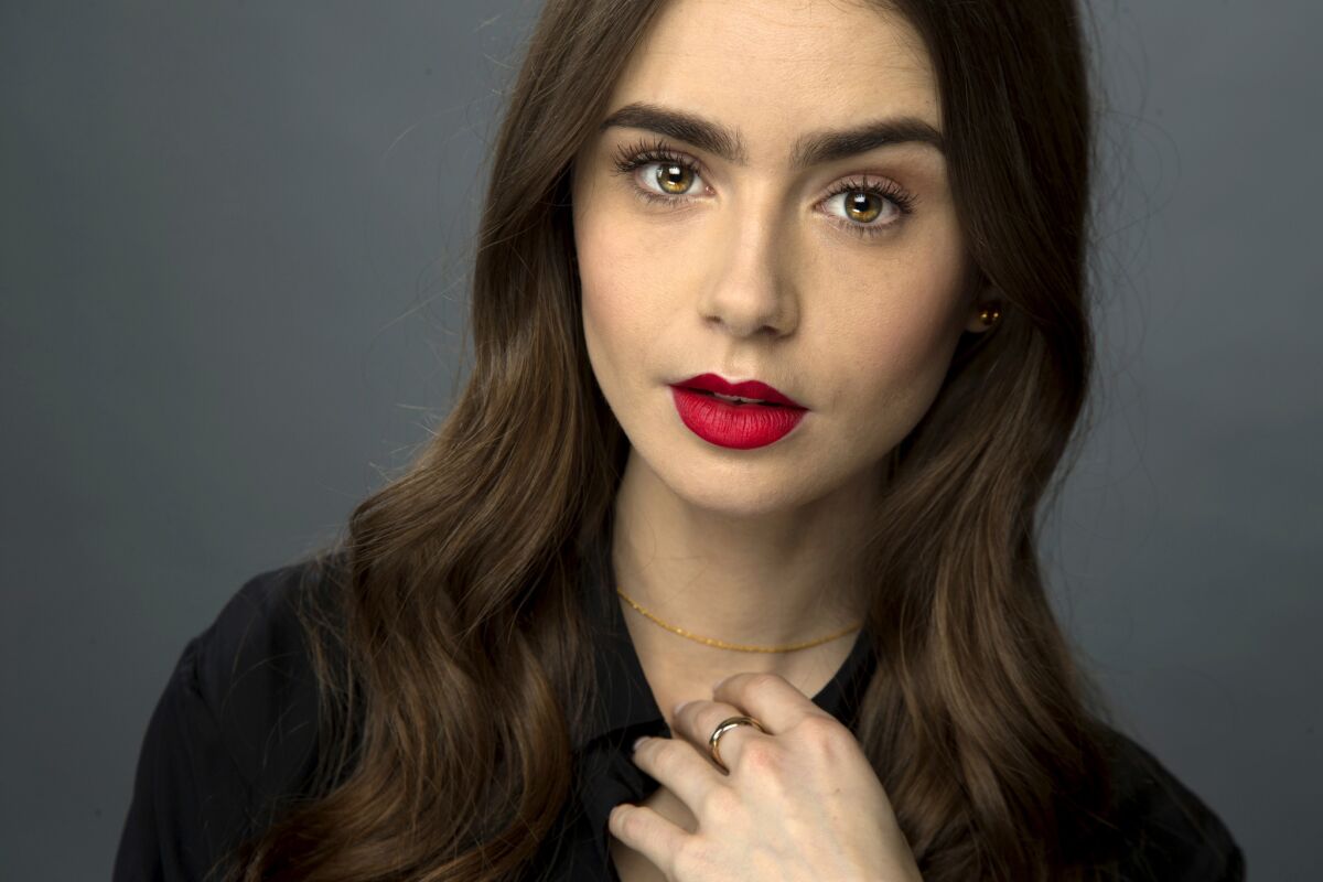 Lily Collins wearing red lipstick
