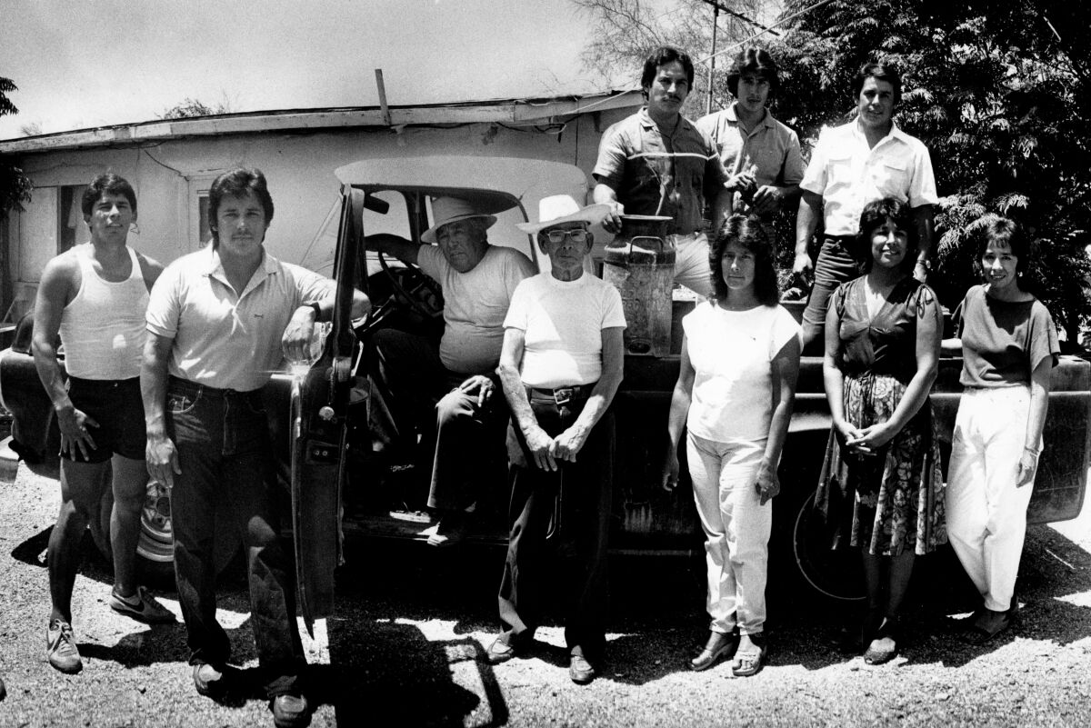 Reporter Virginia Escalante, right, with her family and their 1957 Ford pickup.