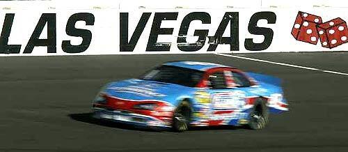 A stock car streaks along at the Las Vegas Motor Speedway complex, where companies give customers an idea of what its like to compete. Avid amateurs can even sign on for a program that enables them to race with the Sports Car Club of America.
