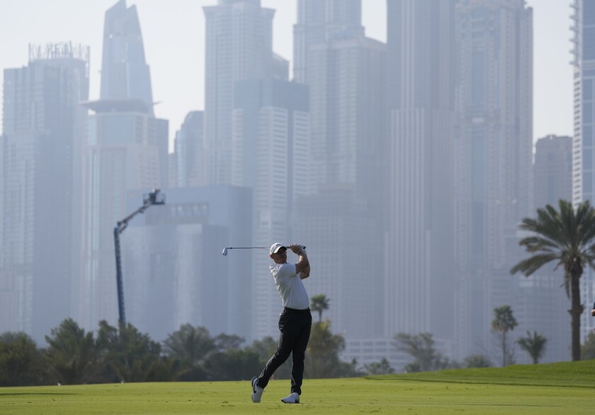Rory McIlroy of Northern Ireland plays a shot on the 13th hole during second round of the Dubai Desert Classic golf tournament in Dubai, United Arab Emirates, Friday, Jan. 28, 2022. (AP Photo/Kamran Jebreili)