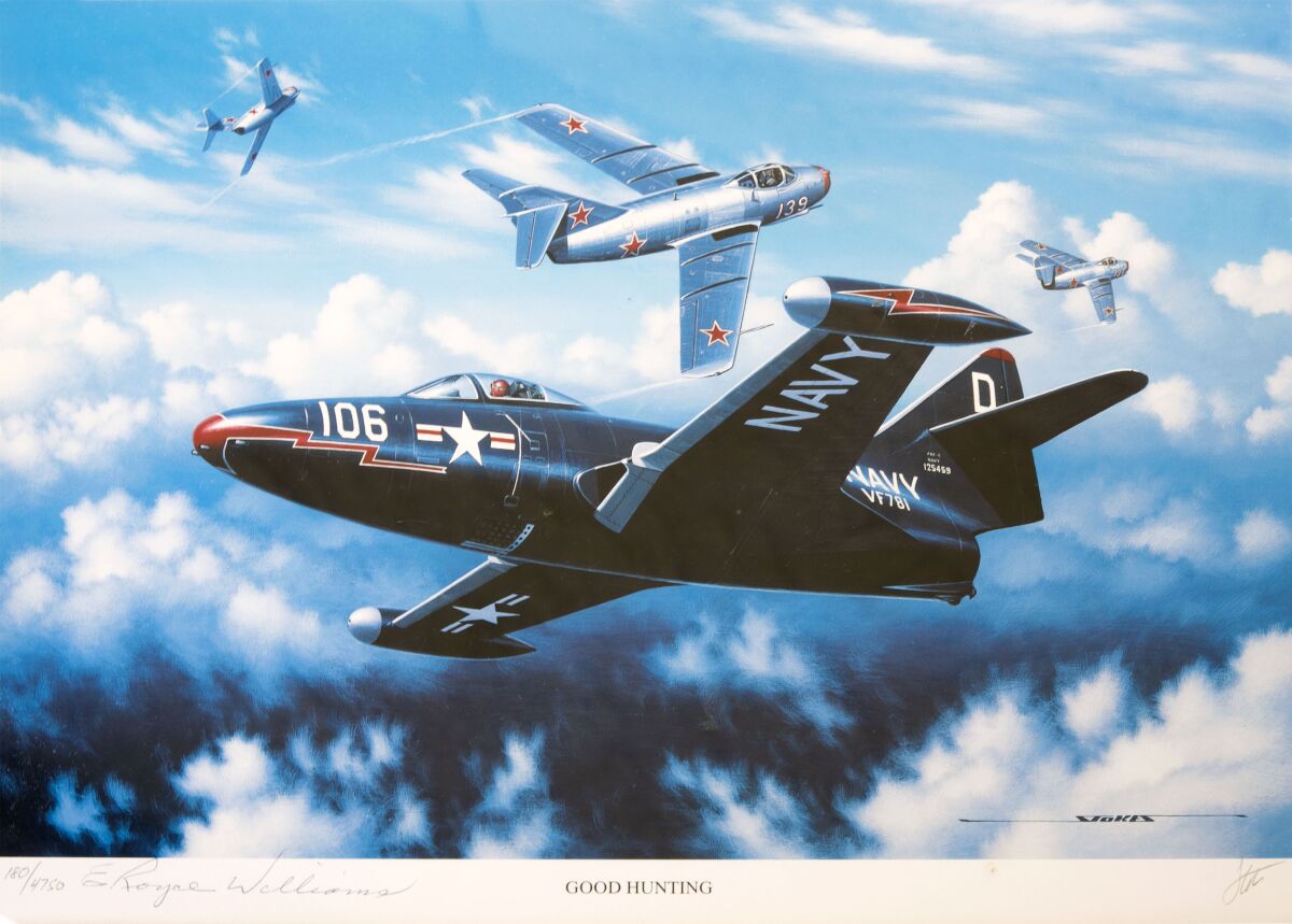 A signed print by artist Stan Stokes depicts a U.S. Navy F9F-5 Panther fighter jet.
