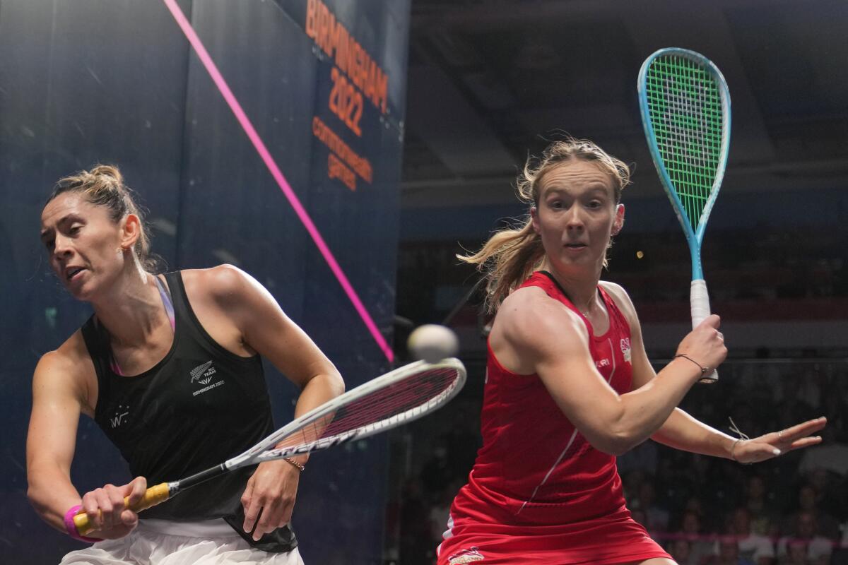 New Zealand's Joelle King plays against England's Lucy Turmel during a women's quarterfinal squash game.