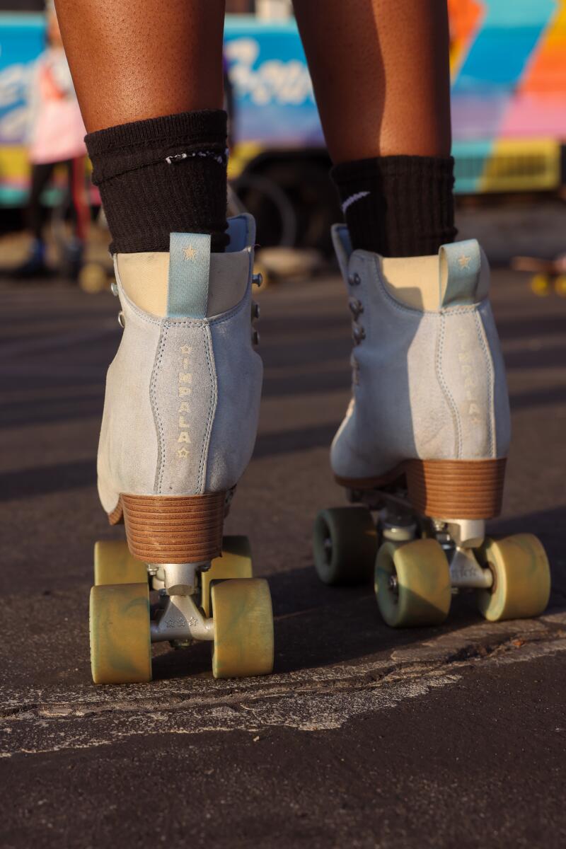 A closeup of a person's feet in roller skates
