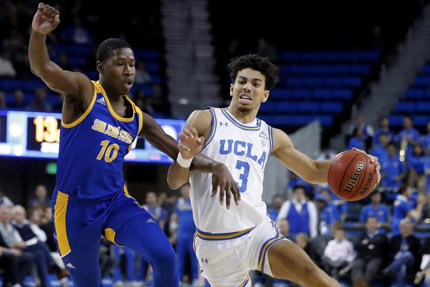 LOS ANGELES, CALIF. - DEC. 1, 2019. Bruins guard Jules Bernard drives down the key against San Jose State guard Omari Moore in the second half at Pauley Pavilion in Los Angeles on Sunday, Dec. 1, 2019. (Luis Sinco/Los Angeles Times)