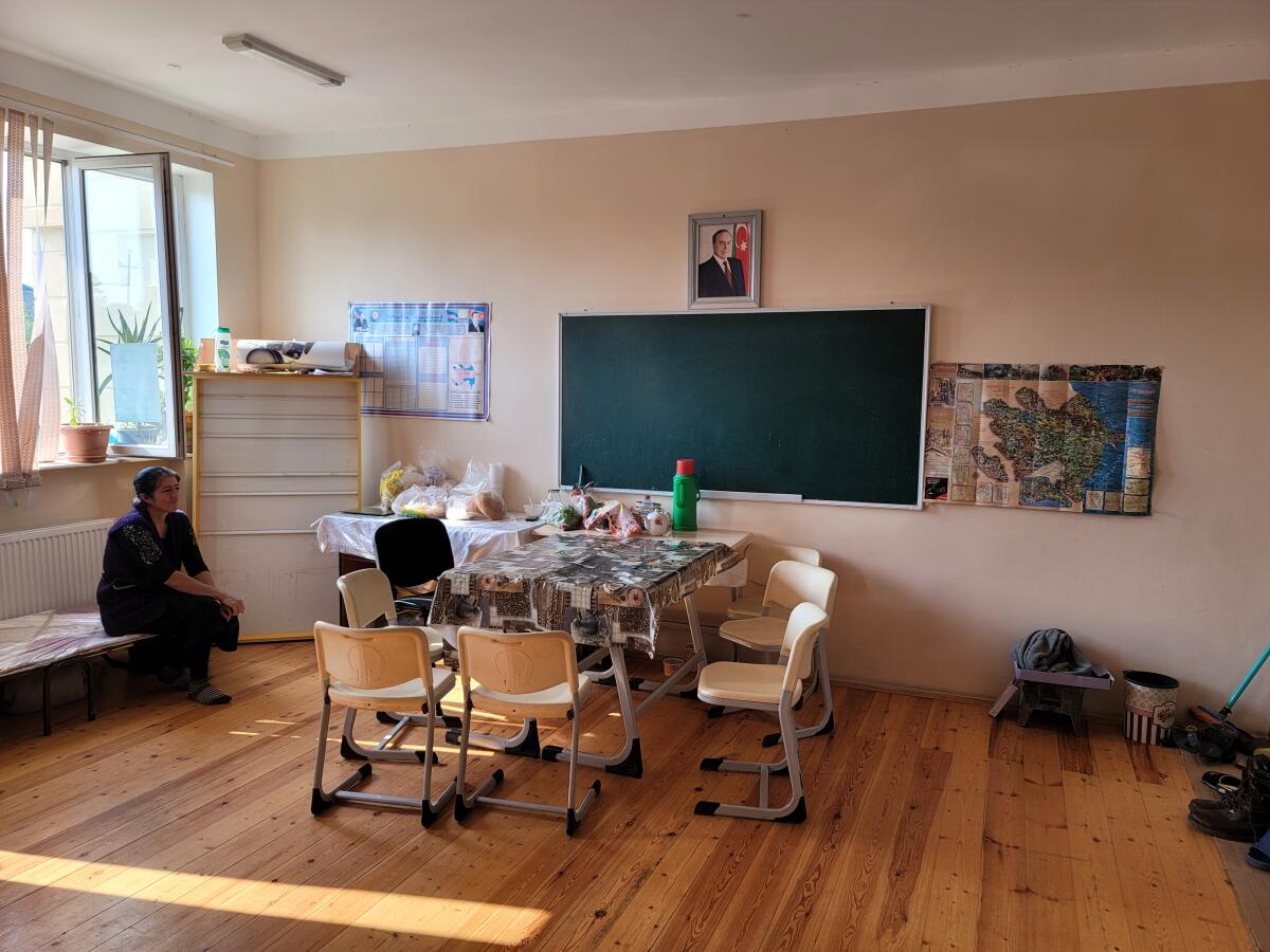 Yegana Ismailova, who fled Nagorno-Karabakh, sits in the classroom that is now her temporary home.