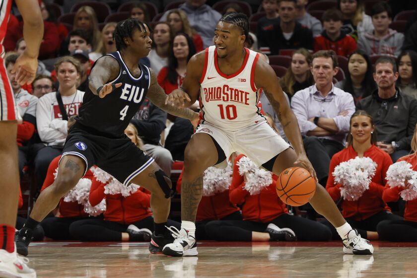 Ohio State's Brice Sensabaugh, right, posts up against Eastern Illinois' Yaakema Rose during the first half of an NCAA college basketball game Wednesday, Nov. 16, 2022, in Columbus, Ohio. (AP Photo/Jay LaPrete)