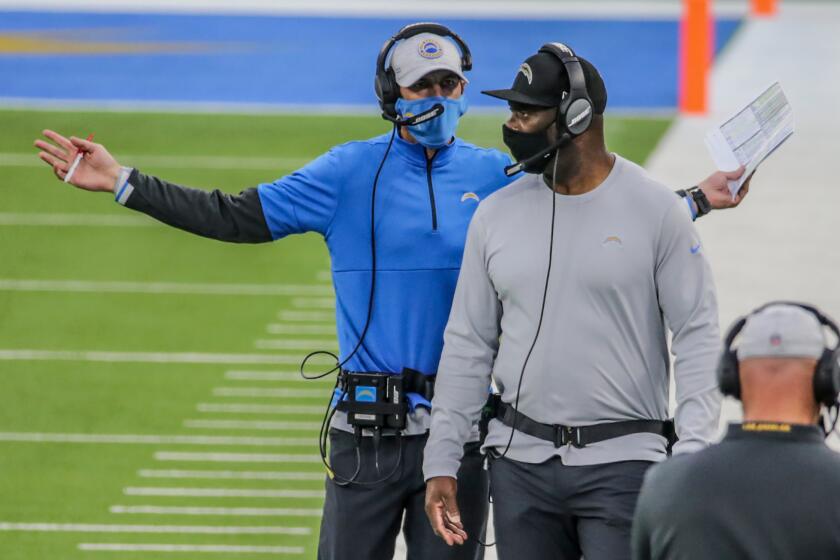 Inglewood, CA, Sunday, December 6, 2020 - Chargers head coach Anthony Lynn, right, and offensive coordinator Shan Steichen.