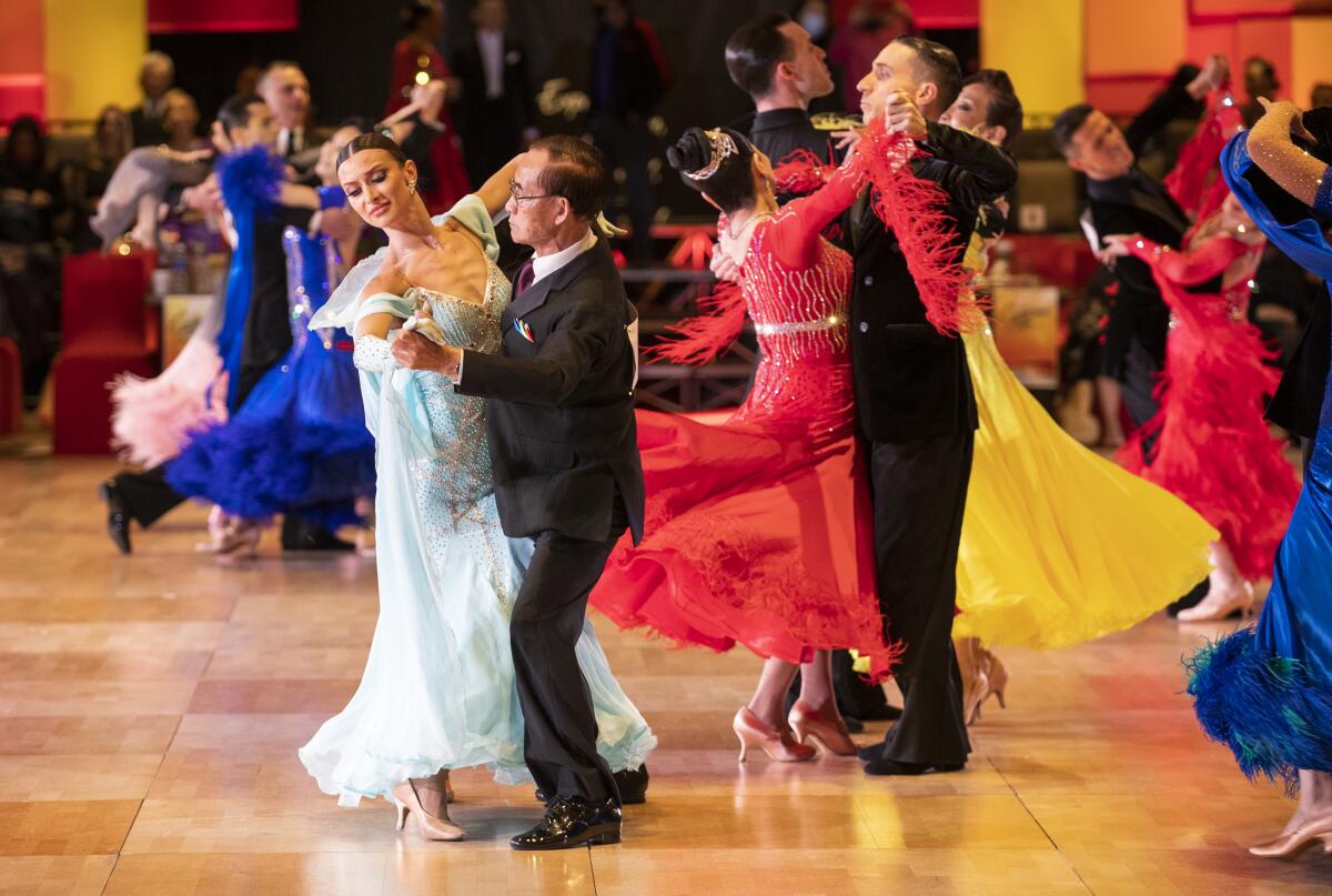 Couples perform in the semi-final round of the DCT senior open ballroom scholarship competition.