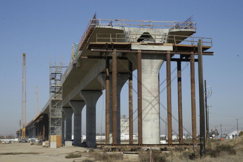 FILE — In this Dec. 6, 2017 file photo, one of the elevated sections of the high-speed rail is under construction in Fresno, Calif. Lawmakers and the Newsom administration are still trying to reach agreement on whether to give the project $4.2 billion that's left in the bond fund voters approved for high-speed rail in 2008. Rail officials say the need it to continue construction beyond next summer, but some state lawmakers want more oversight of the project before releasing it. (AP Photo/Rich Pedroncelli, File)