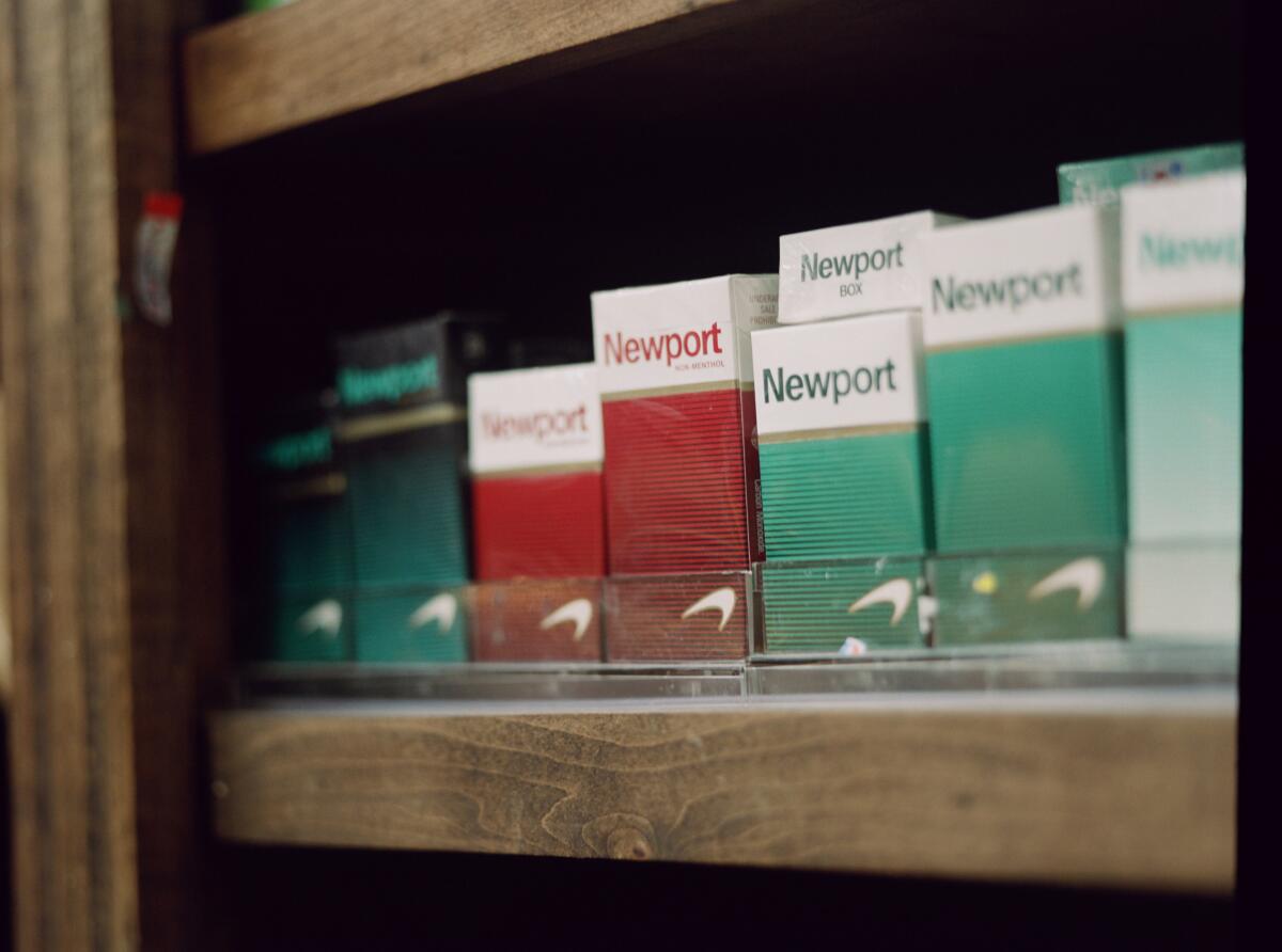 A row of Newport cigarettes on a shelf at the Food Mart in New Orleans.