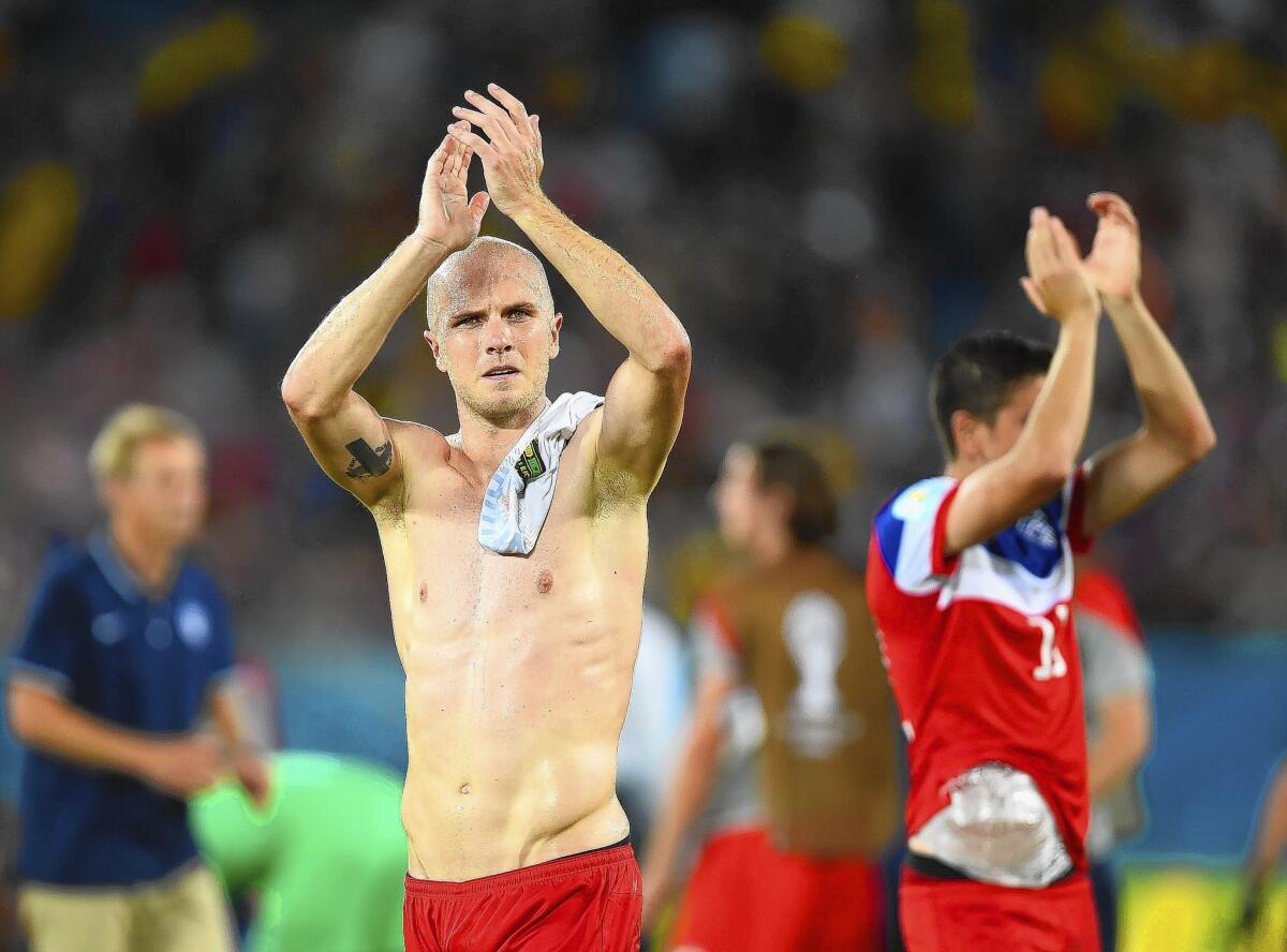 Michael Bradley acknowledges fans after the U.S. team defeated Ghana 2-1 in Natal, Brazil.