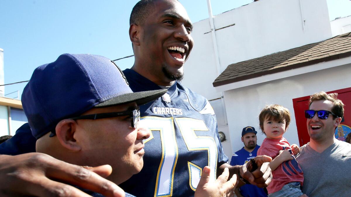 Chargers offensive tackle Chris Hairston greets fans in an appearance at Pink's Hot Dogs in Los Angeles on Tuesday.
