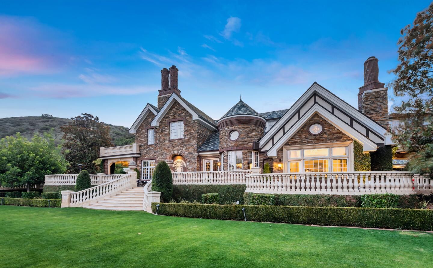 The compound centers on a 10,000-square-foot English-style manor, which the couple remodeled during their stay.