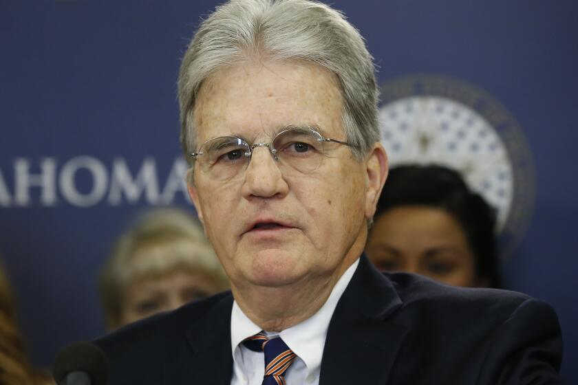 FILE - In this March 28, 2018 file photo, former U.S. Sen. Tom Coburn speaks at a news conference in Oklahoma City. Coburn has died. He was 72. A cousin tells The Associated Press that he died early Saturday, March 28, 2020. Coburn had been diagnosed with prostate cancer years earlier. The Oklahoma Republican railed against federal earmarking and earned a reputation as a political maverick. (AP Photo/Sue Ogrocki, File)