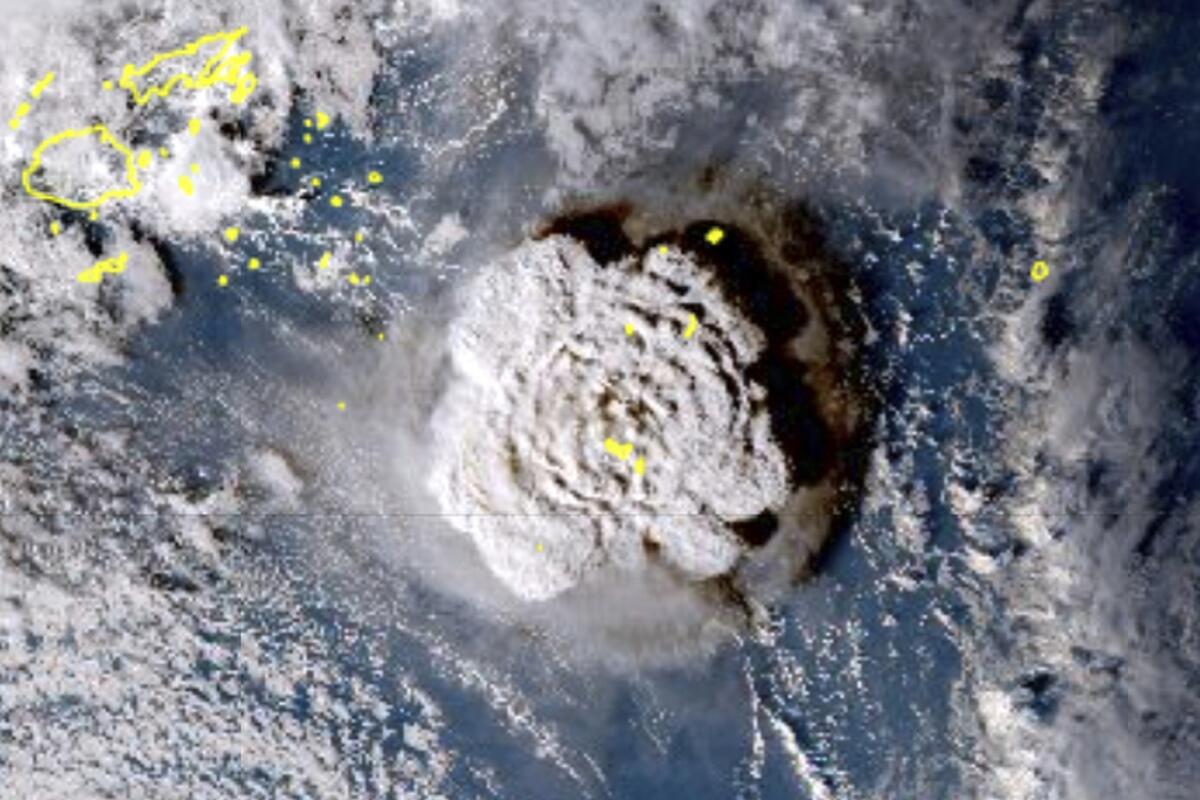 A cloud expands over the ocean in a satellite view of the eruption of the Hunga Tonga-Hunga Ha’apai undersea volcano.