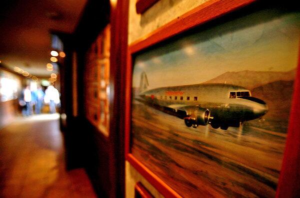 Photographs chronicling the history of aviation line the halls of the Proud Bird restaurant in Los Angeles. Located beside the southernmost runway of LAX, the landmark eatery is scheduled to close.