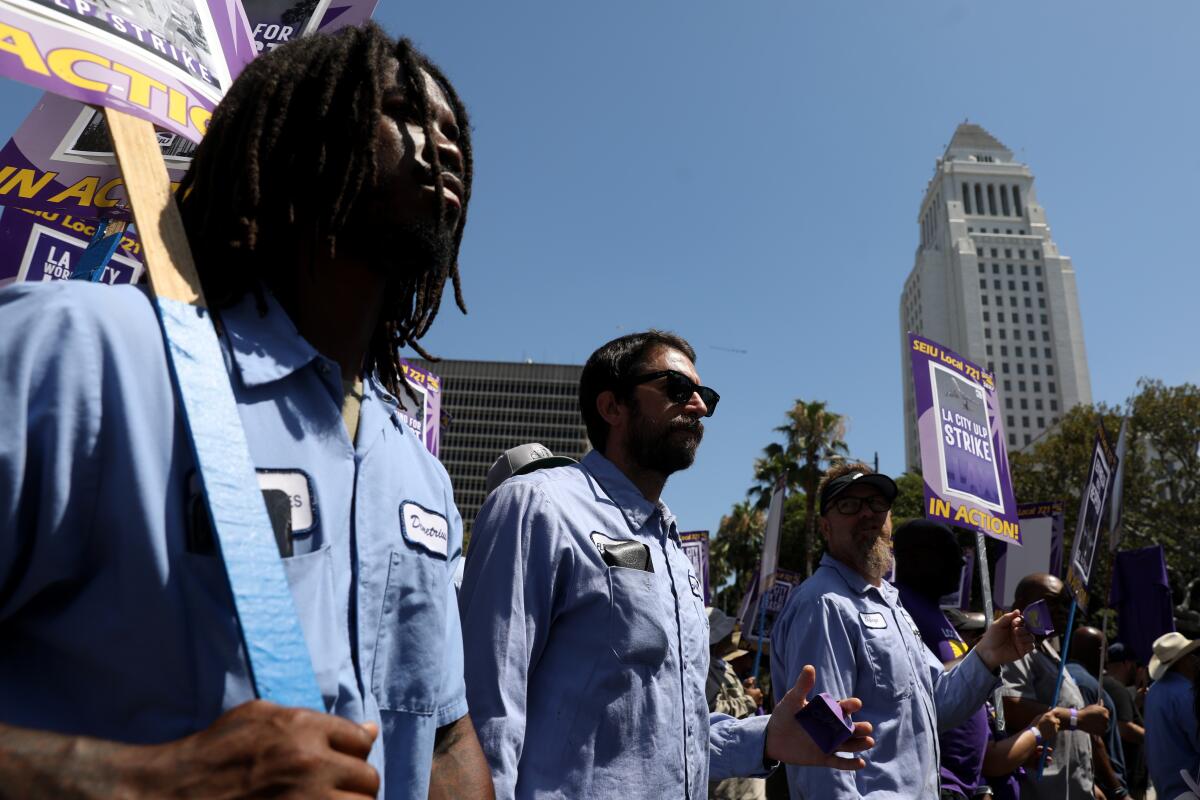 City workers march in downtown L.A.