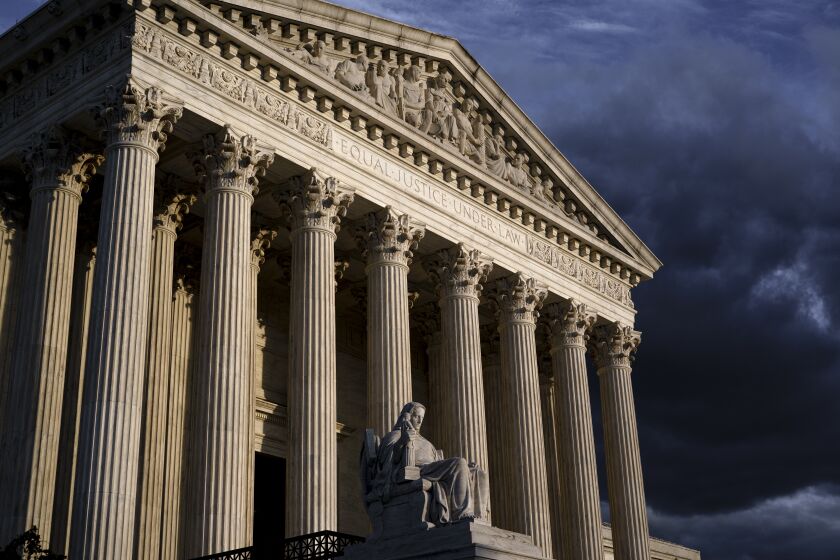 FILE - The Supreme Court is seen at dusk in Washington, Friday, Oct. 22, 2021. The Supreme Court has rejected an emergency appeal from health care workers in Maine to block a vaccine mandate that went into effect Friday, Oct. 29. (AP Photo/J. Scott Applewhite, File)