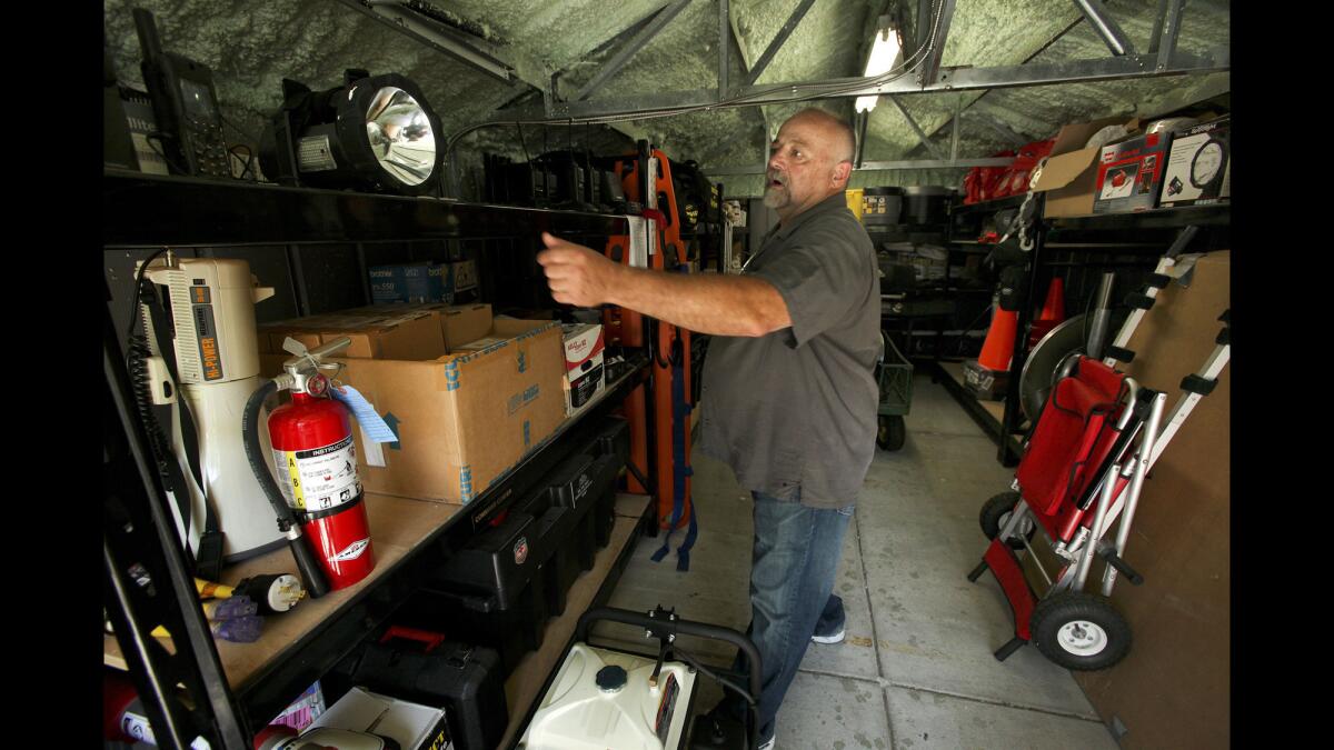 Bel Air Operations Manager Rick Cole points out some of the $50,000-worth of supplies the community has gathered to protect its residents in the event of a disaster.