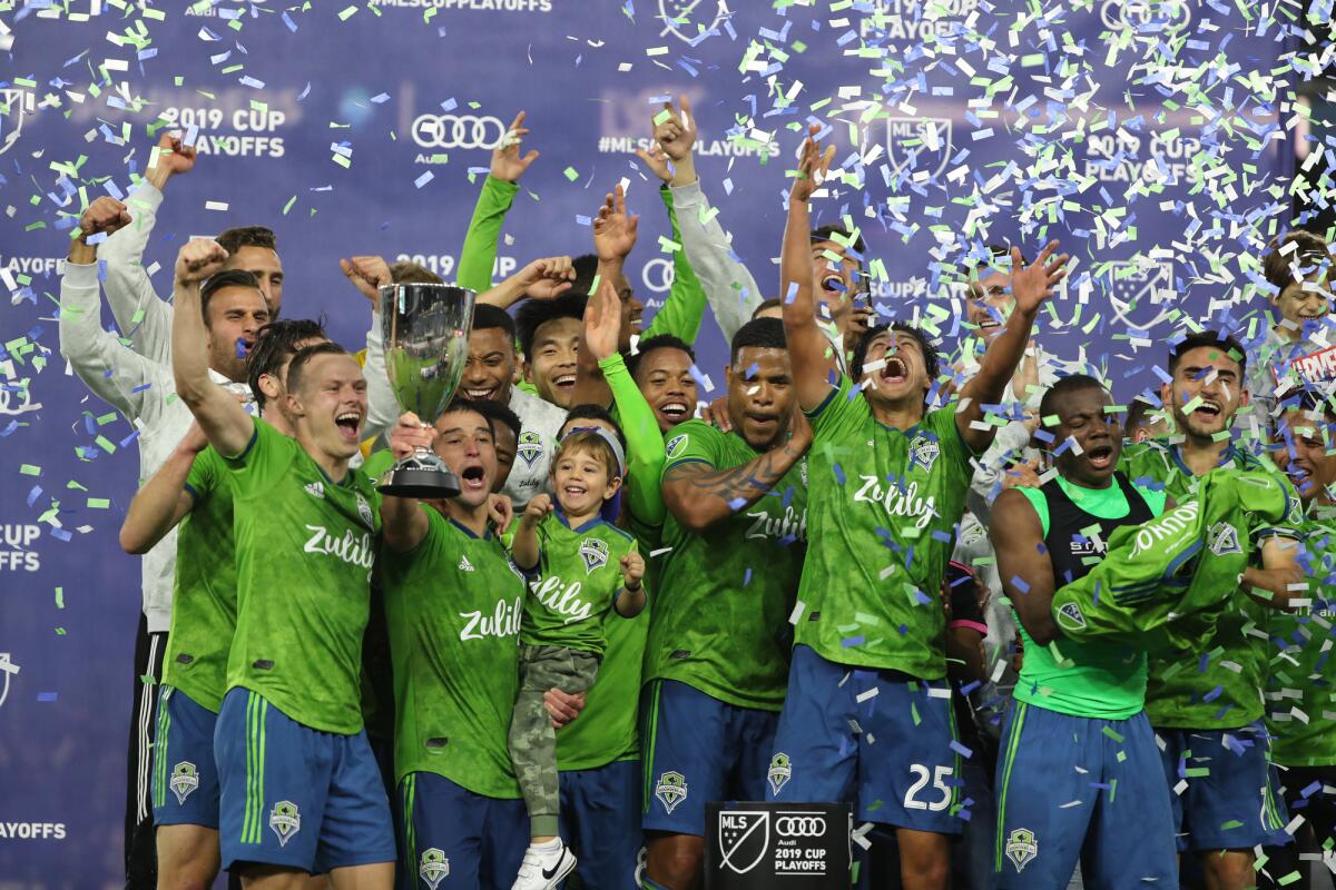 Seattle Sounders players celebrate their 3-1 victory over LAFC.