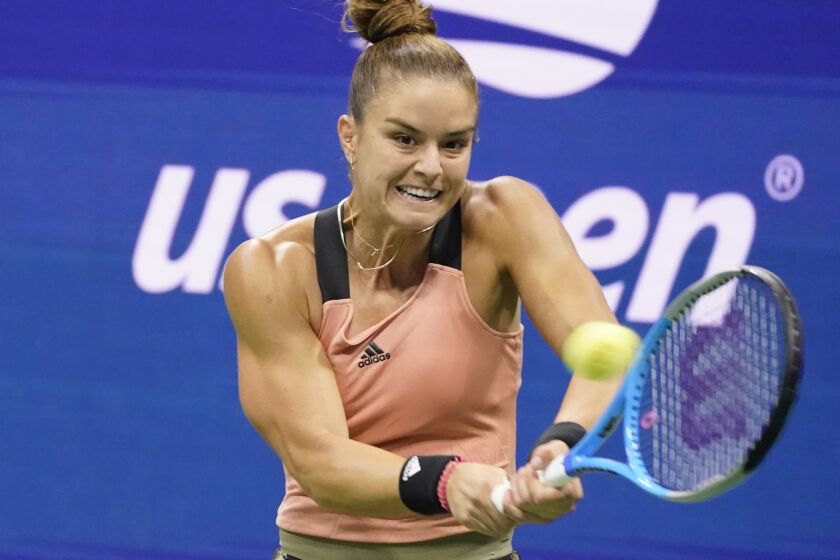 Maria Sakkari, of Greece, returns to Bianca Andreescu, of Canada, during the fourth round of the US Open tennis championships, Tuesday, Sept. 7, 2021, in New York. (AP Photo/John Minchillo)