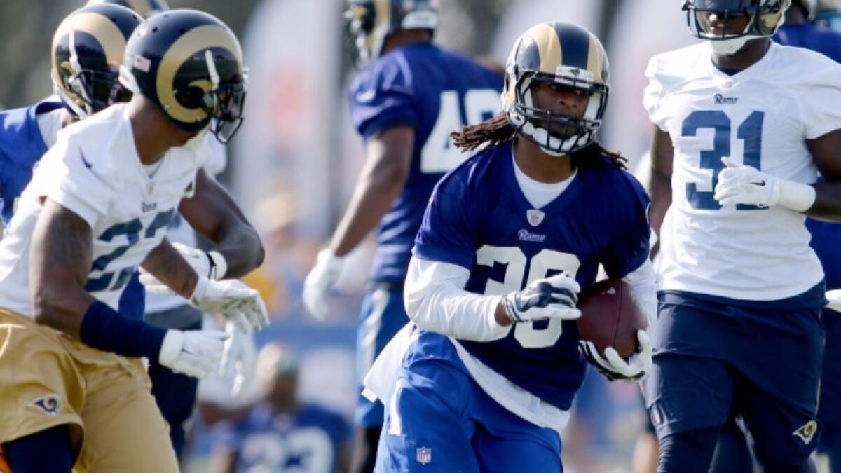 Rams running back Todd Gurley runs with the ball during a training camp practice on July 30.