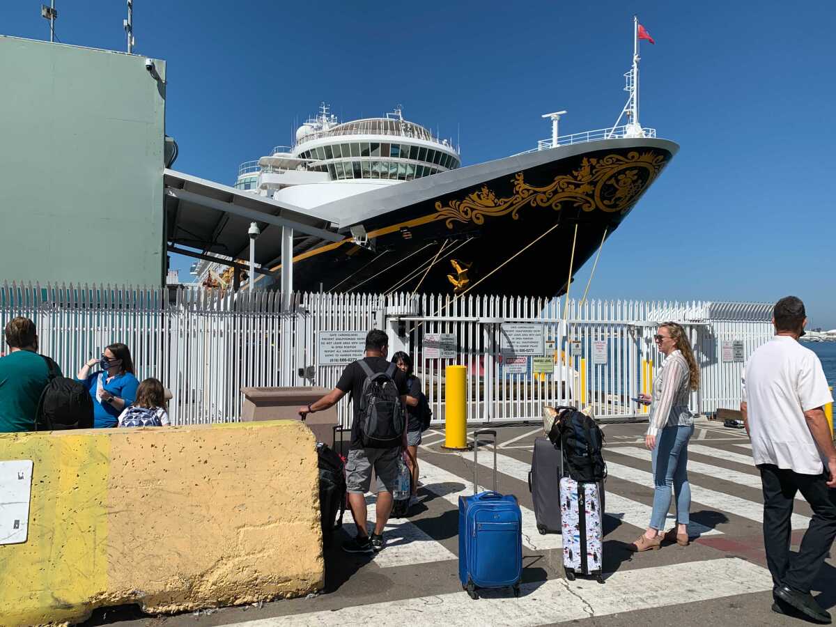Passengers board the Disney Wonder for a test cruise.