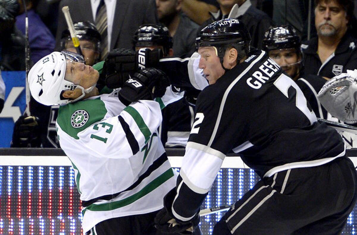 Kings defenseman Matt Greene sends Stars left wing Ray Whitney reeling during the third period of a game last month at Staples Center.