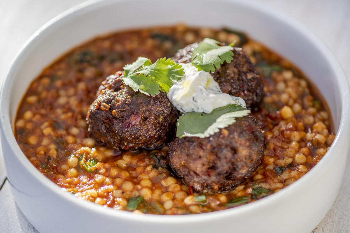 Lamb meatballs are served with M'hamsa stew and labneh at Barsha.