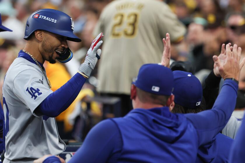 Dodgers star Mookie Betts rounds the bases after hitting a solo home run against the Padres at Petco Park.