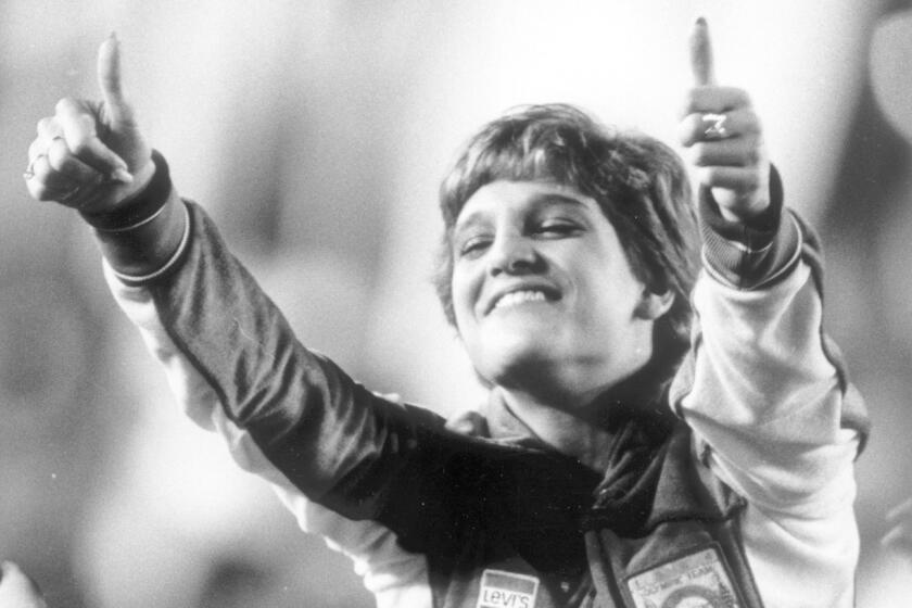 Gymnastics gold medal winner Mary Lou Retton participates in closing ceremonies of the 1984 Olympic Games.