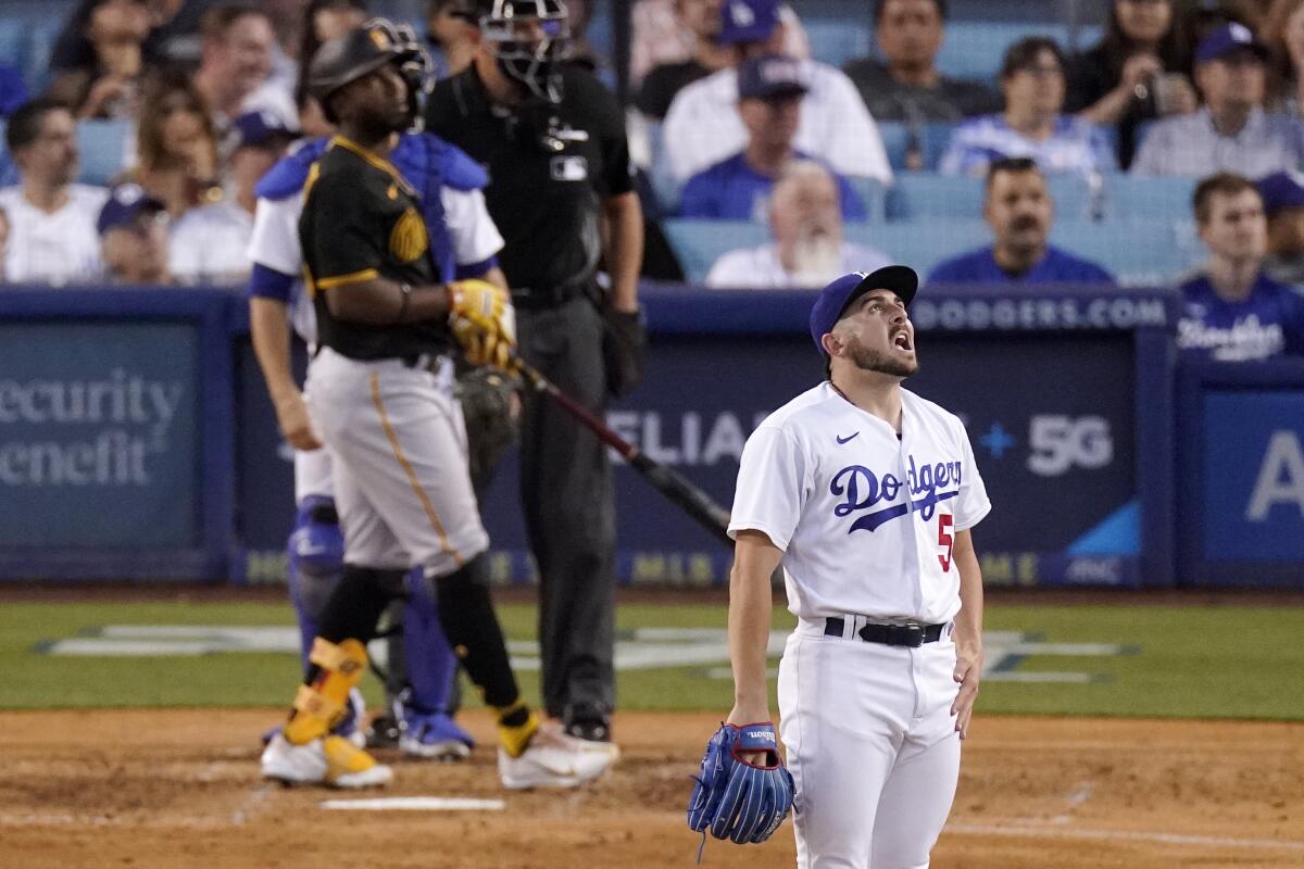 Dodgers relief pitcher Alex Vesia watches as a ball hit by Pirates' Rodolfo Castro goes out for a two-run home run.