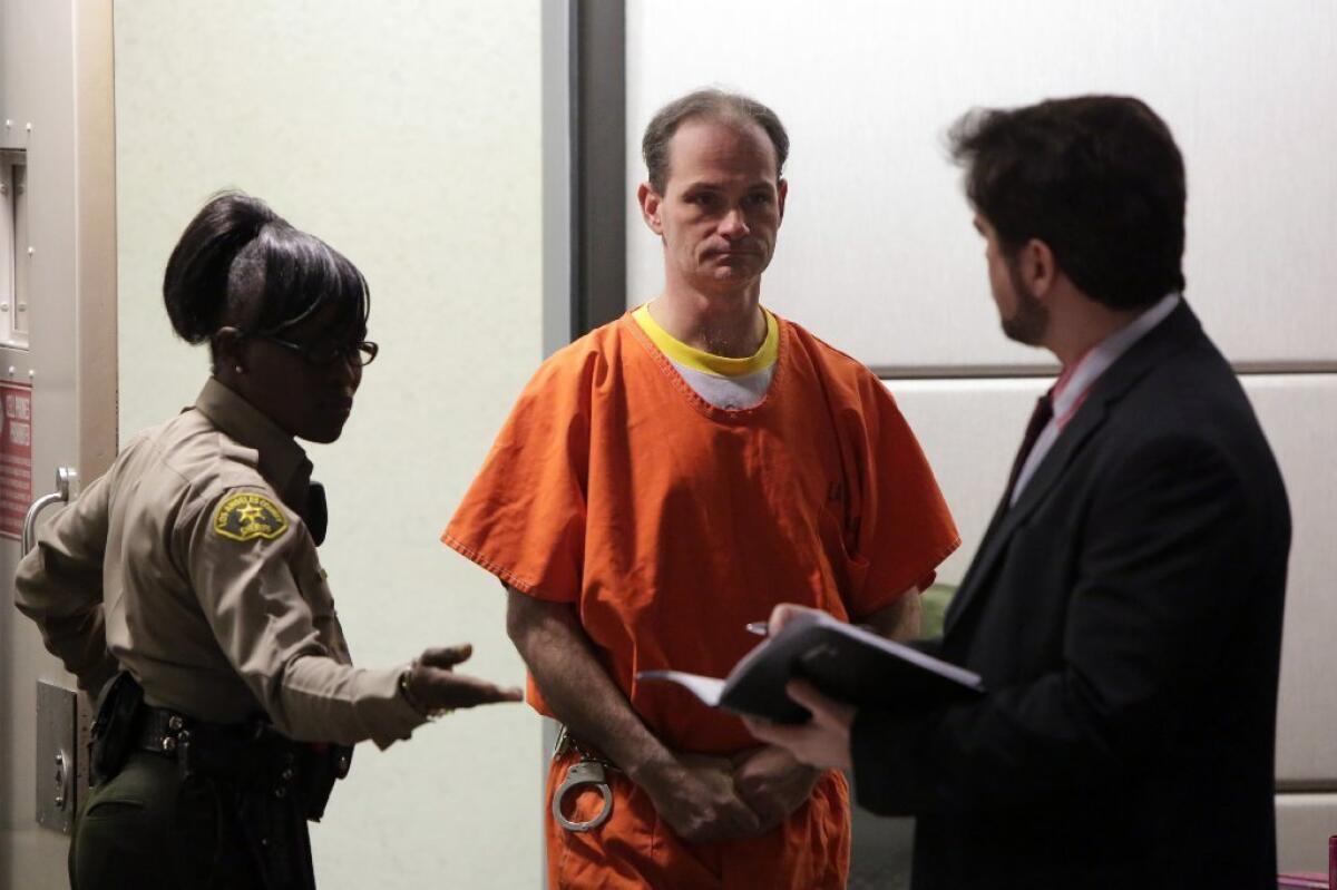 Nathan Louis Campbell appears for arraignment in January with his attorney, public defender Philip Dube, at the Airport courthouse in Los Angeles.