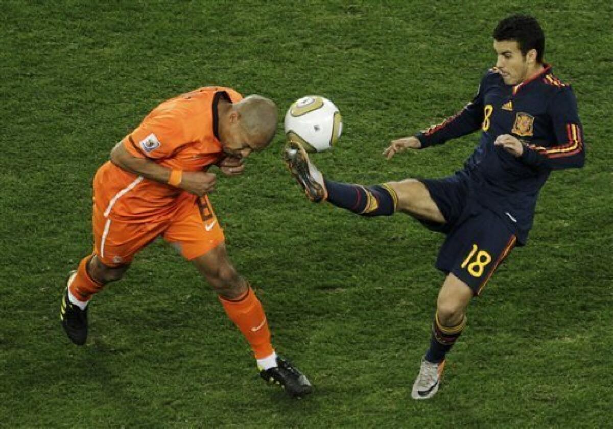 Gregory van der Wiel of the Netherlands controls the ball during the 2010  FIFA World Cup final match between the Netherlands and Spain at the Soccer  City Stadium in Johannesburg, South Africa