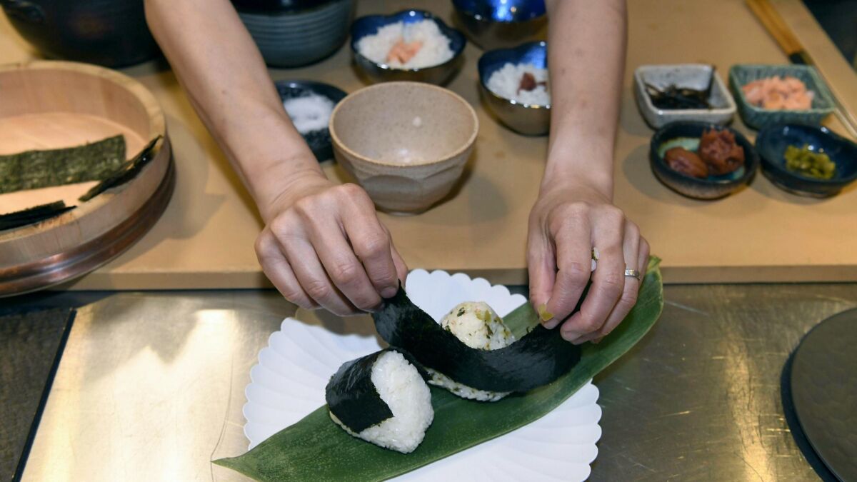 Wrap nori around the onigiri right before serving so that it stays crisp.