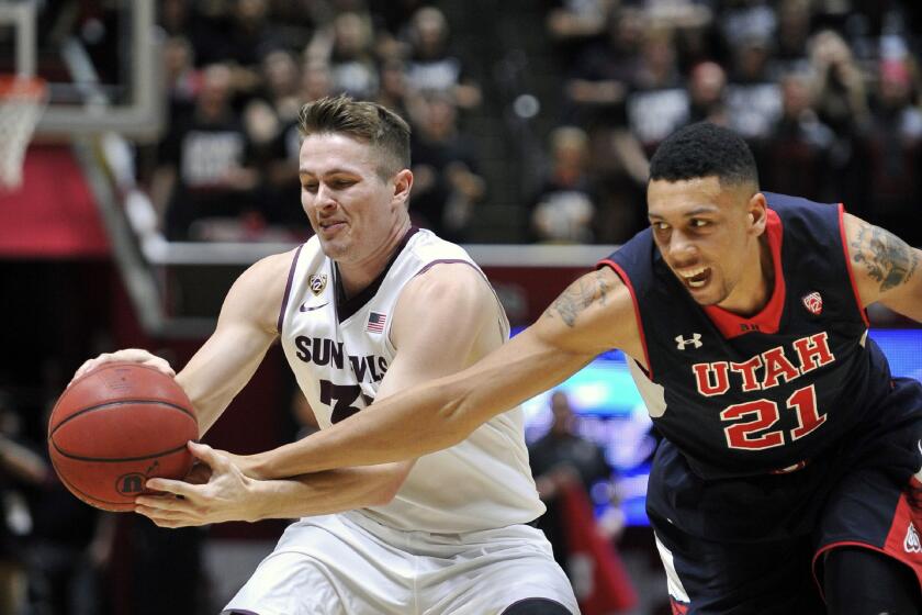 Utah's Jordan Loveridge tries to steal the ball from Arizona State's Bo Barnes in the second half Thursday night.